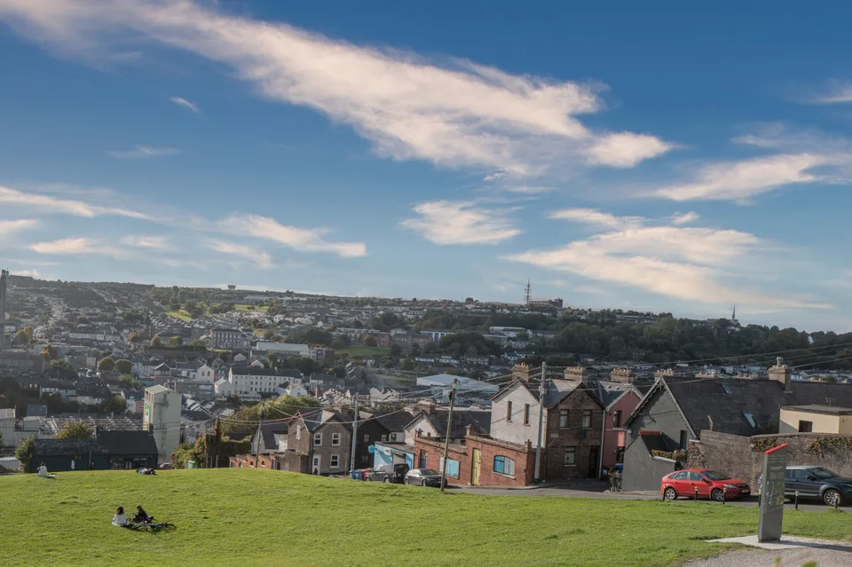 Cork city rooftops and church towers seen from Bell's Field
