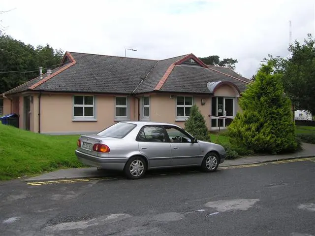 Lifford Health Centre, Co. Donegal: single-storey HSE health centre exterior with one parked car