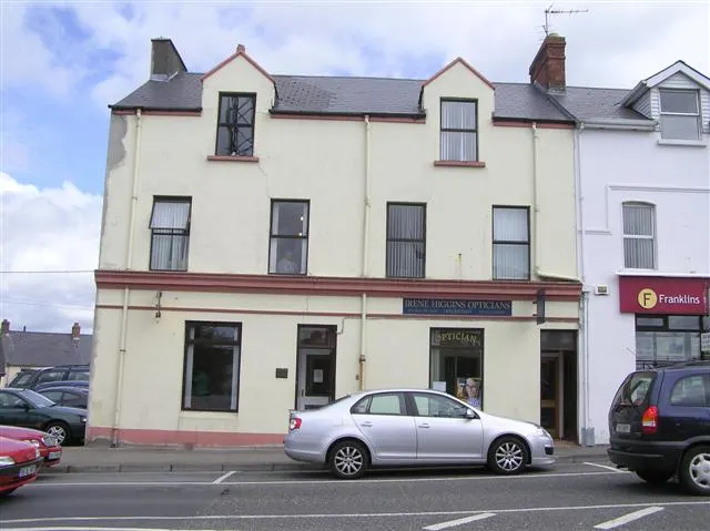 Irene Higgins Opticians shopfront, West End, Buncrana, Co. Donegal, with parked cars